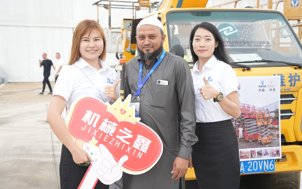 International buyer viewing construction equipment with the Kaihui Cranes team