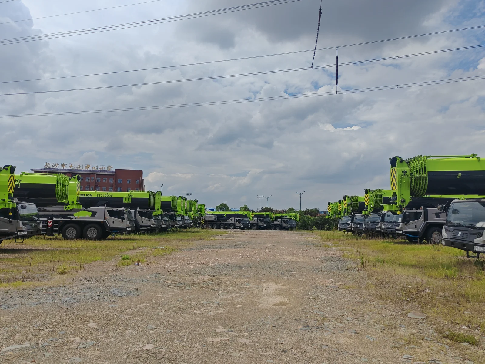 Large mobile crane fleet lined up at the equipment yard