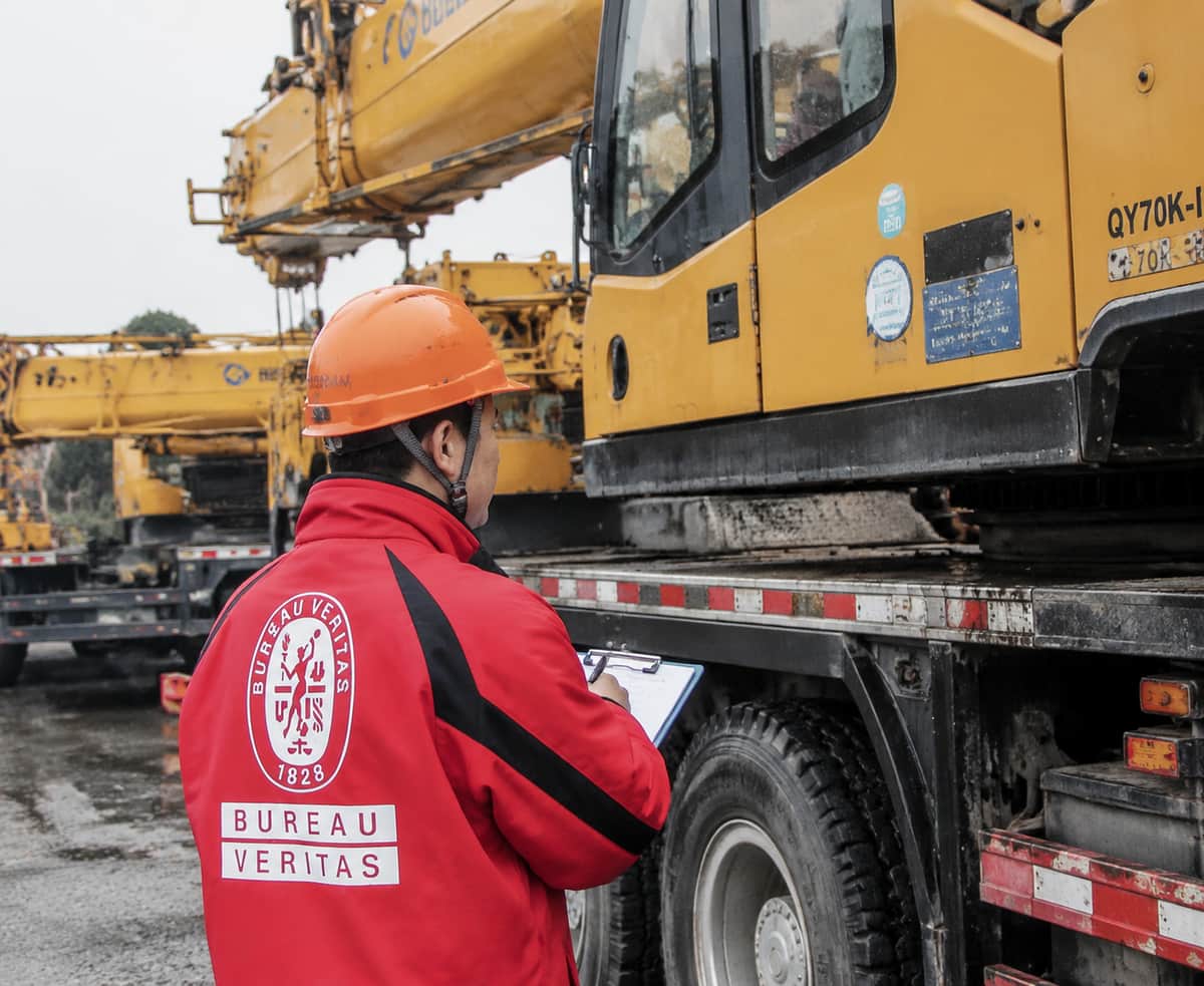 Third-party inspector checking a mobile crane on site