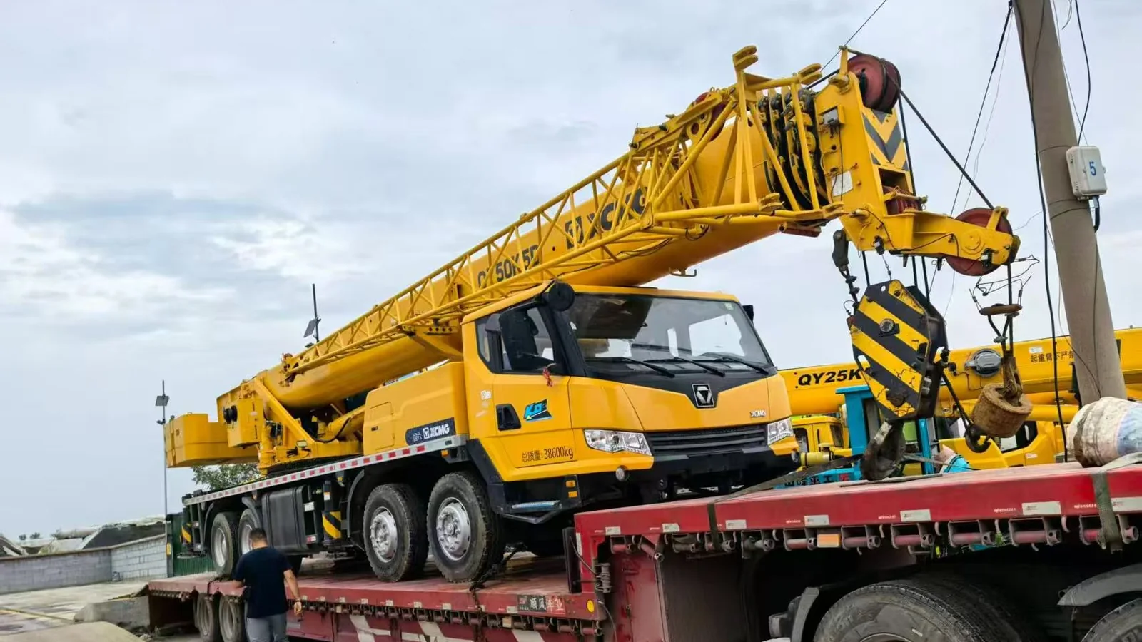 XCMG truck crane transported to the port by lowbed trailer